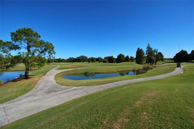 a view of a golf course with a lake