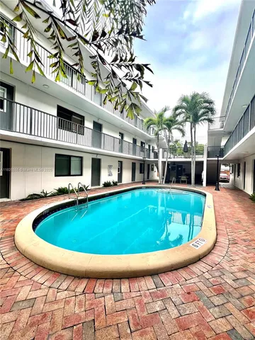 a view of swimming pool with seating space