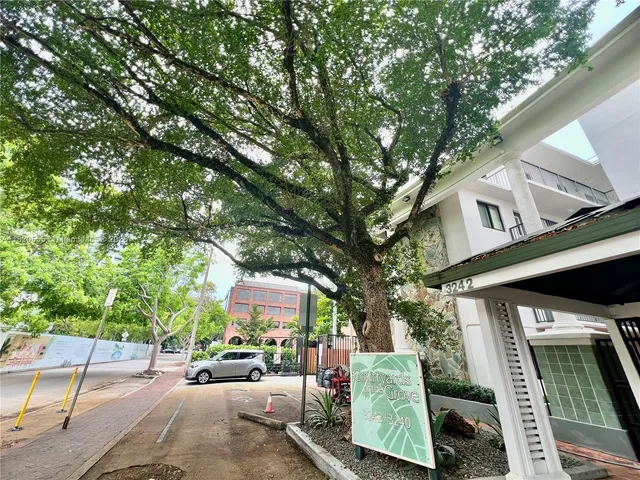 a view of a car park in front of house