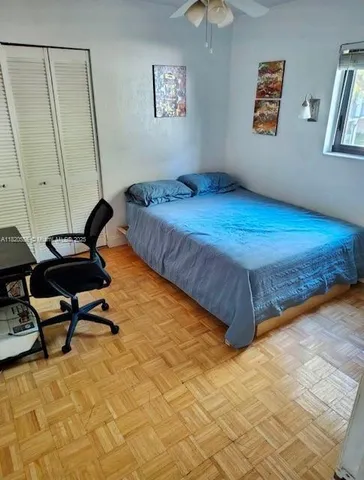 a bedroom with a bed and furniture