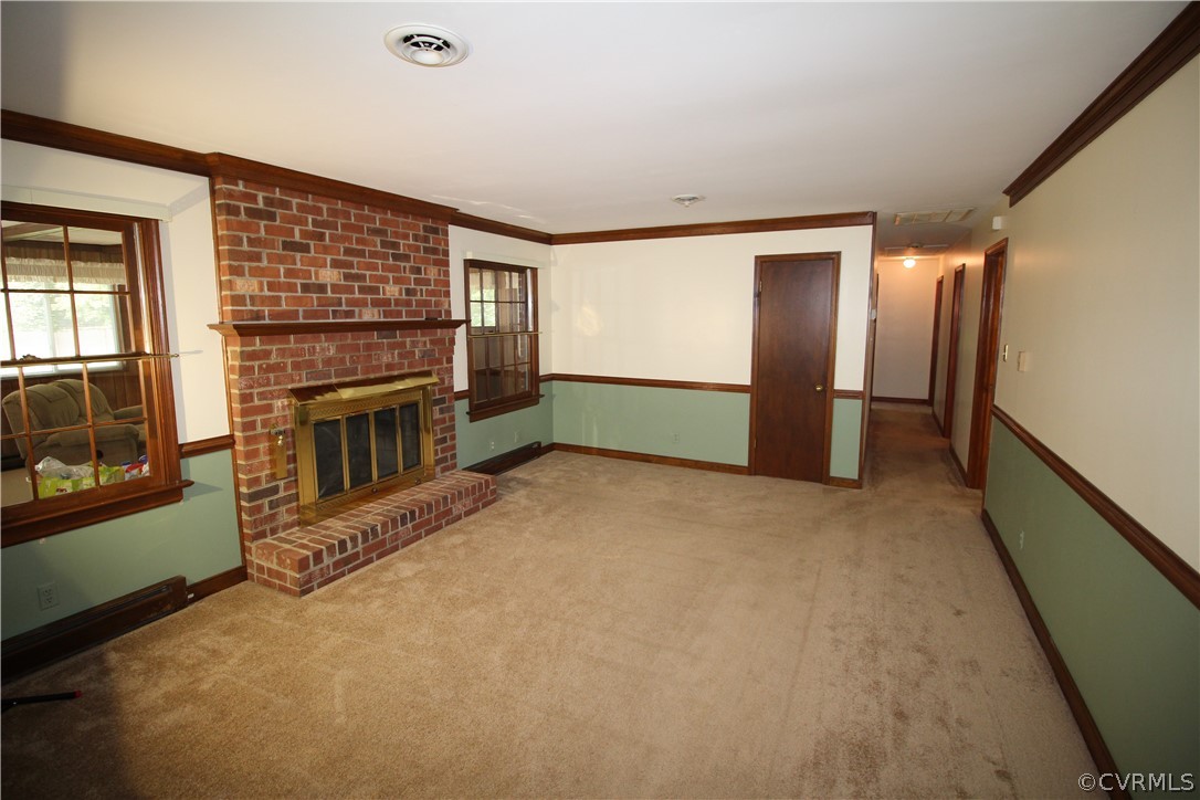 14111 Puritan Road Chesterfield, VA 23838 - Photo 16 of 49 a view of an empty room with a fireplace and a window