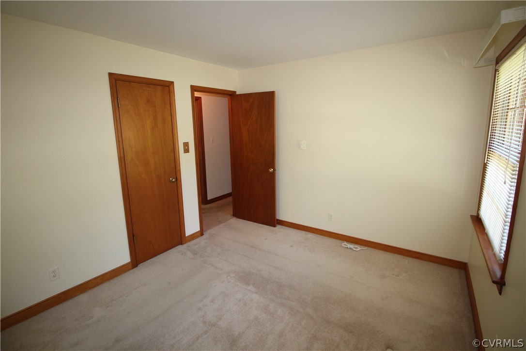 14111 Puritan Road Chesterfield, VA 23838 - Photo 23 of 49 an empty room with windows and bathroom
