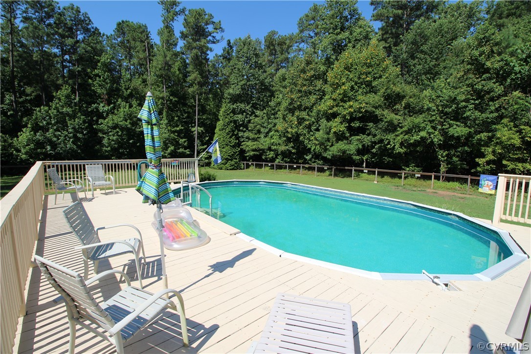 14111 Puritan Road Chesterfield, VA 23838 - Photo 5 of 49 a view of a swimming pool with a patio
