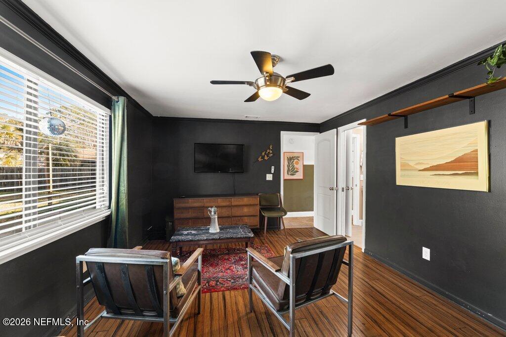 1810 Kings Way Neptune Beach, FL 32266 - Photo 22 of 40 a living room with furniture a flat screen tv and a window