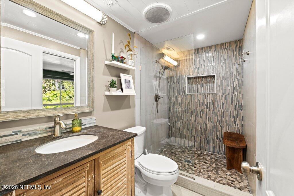 1810 Kings Way Neptune Beach, FL 32266 - Photo 23 of 40 a bathroom with a granite countertop sink toilet and shower