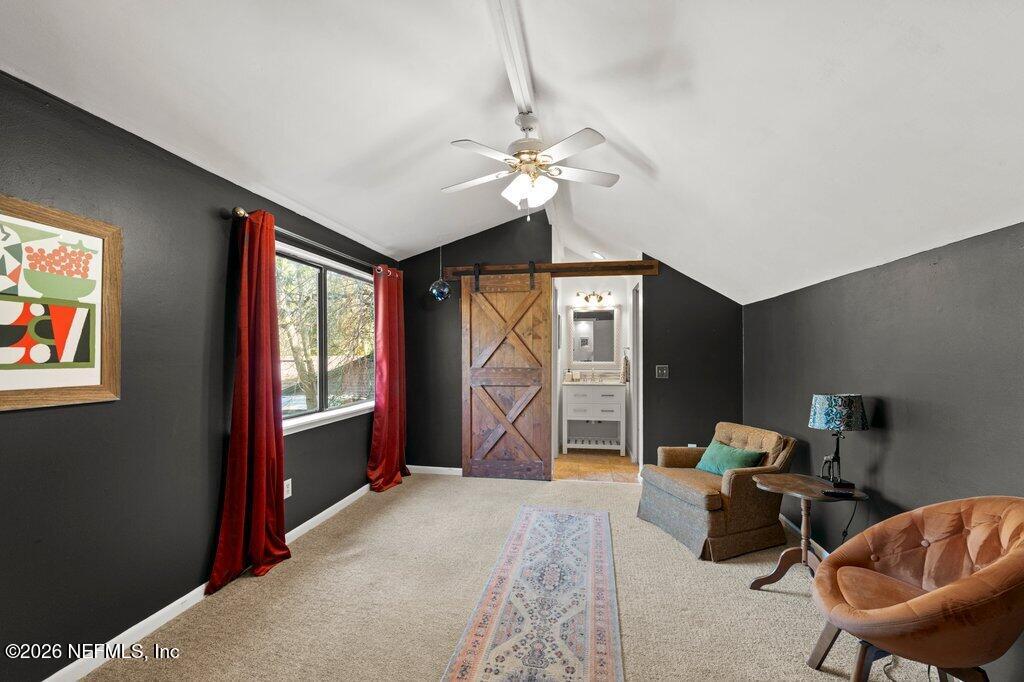 1810 Kings Way Neptune Beach, FL 32266 - Photo 24 of 40 a living room with furniture a chandelier and a window