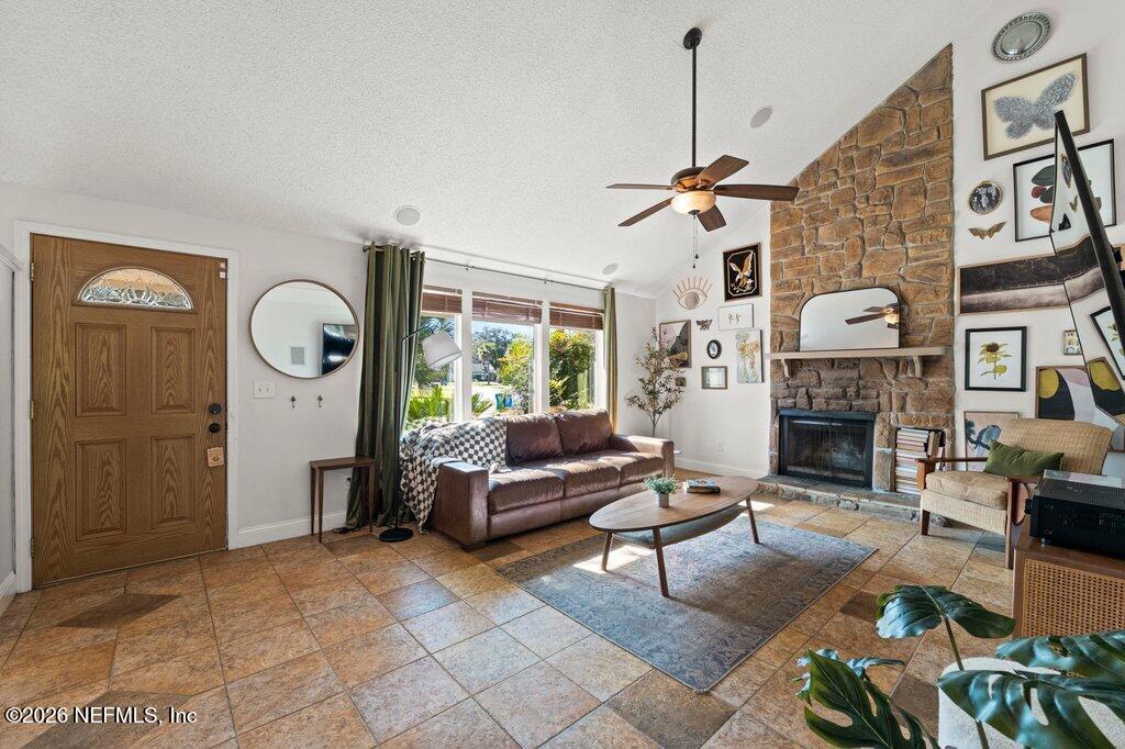 1810 Kings Way Neptune Beach, FL 32266 - Photo 3 of 40 a living room with furniture a fireplace and a large mirror