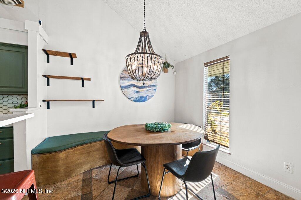 1810 Kings Way Neptune Beach, FL 32266 - Photo 8 of 40 a view of a dining room with furniture window and wooden floor