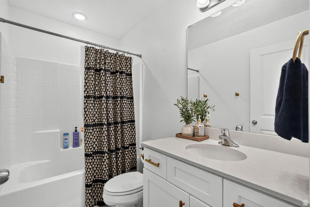 5898 Jasper Rdg Drive St. George, UT 84790 - Photo 24 of 41 Spa-inspired bathroom featuring a clean-lined vanity with dual sinks, quartz countertop, and brass hardware