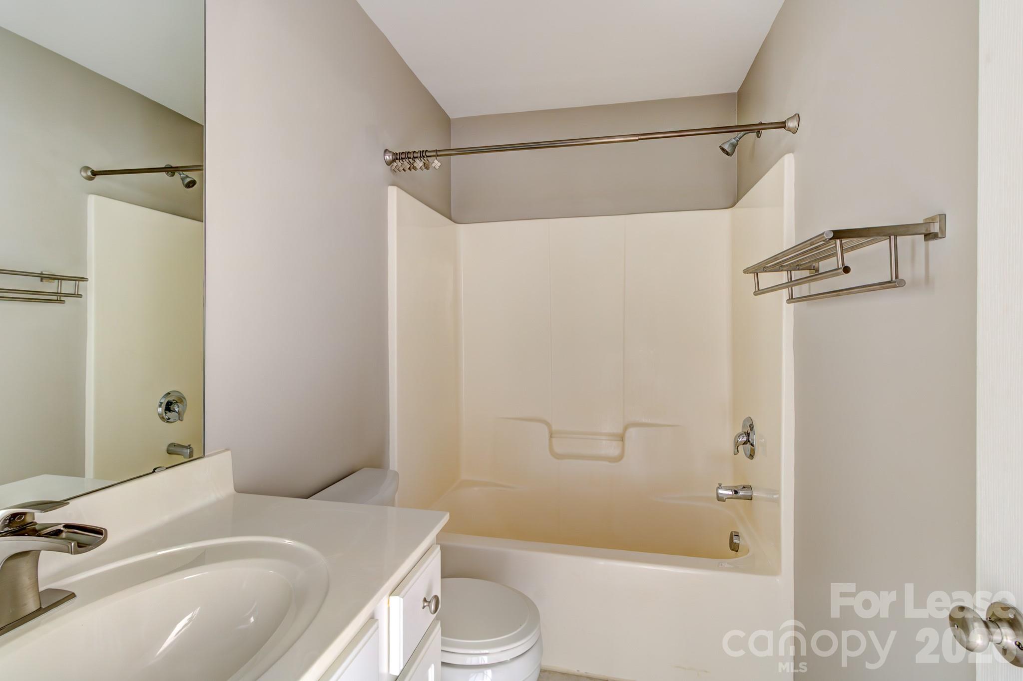 417 River Park Road Belmont, NC 28012 - Photo 11 of 16 a bathroom with a sink toilet and shower