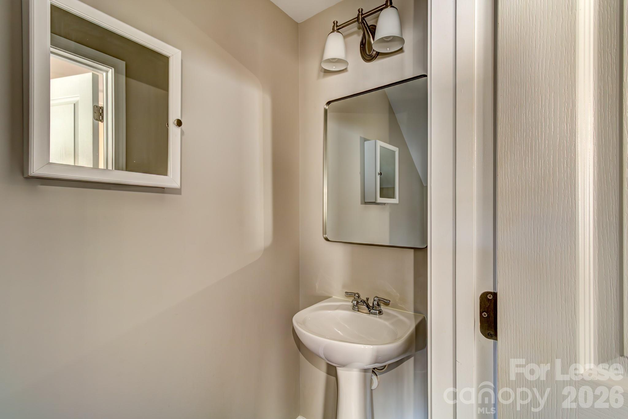 417 River Park Road Belmont, NC 28012 - Photo 13 of 16 a bathroom with a toilet sink and mirror