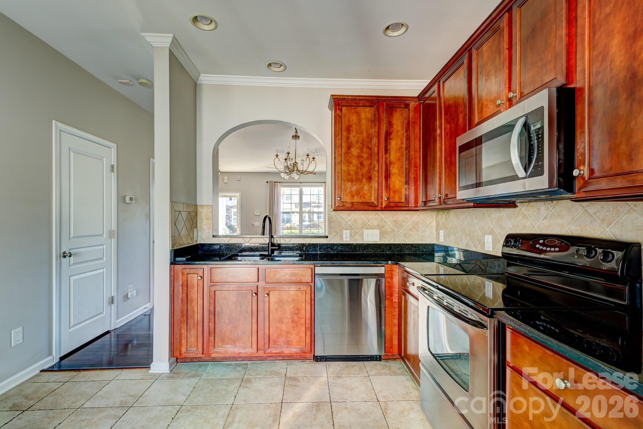 417 River Park Road Belmont, NC 28012 - Photo 6 of 16 a kitchen with stainless steel appliances granite countertop a stove sink and cabinets