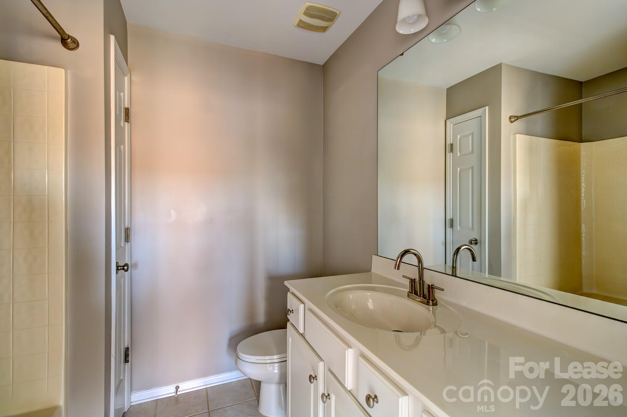 417 River Park Road Belmont, NC 28012 - Photo 9 of 16 a bathroom with a granite countertop sink toilet and shower