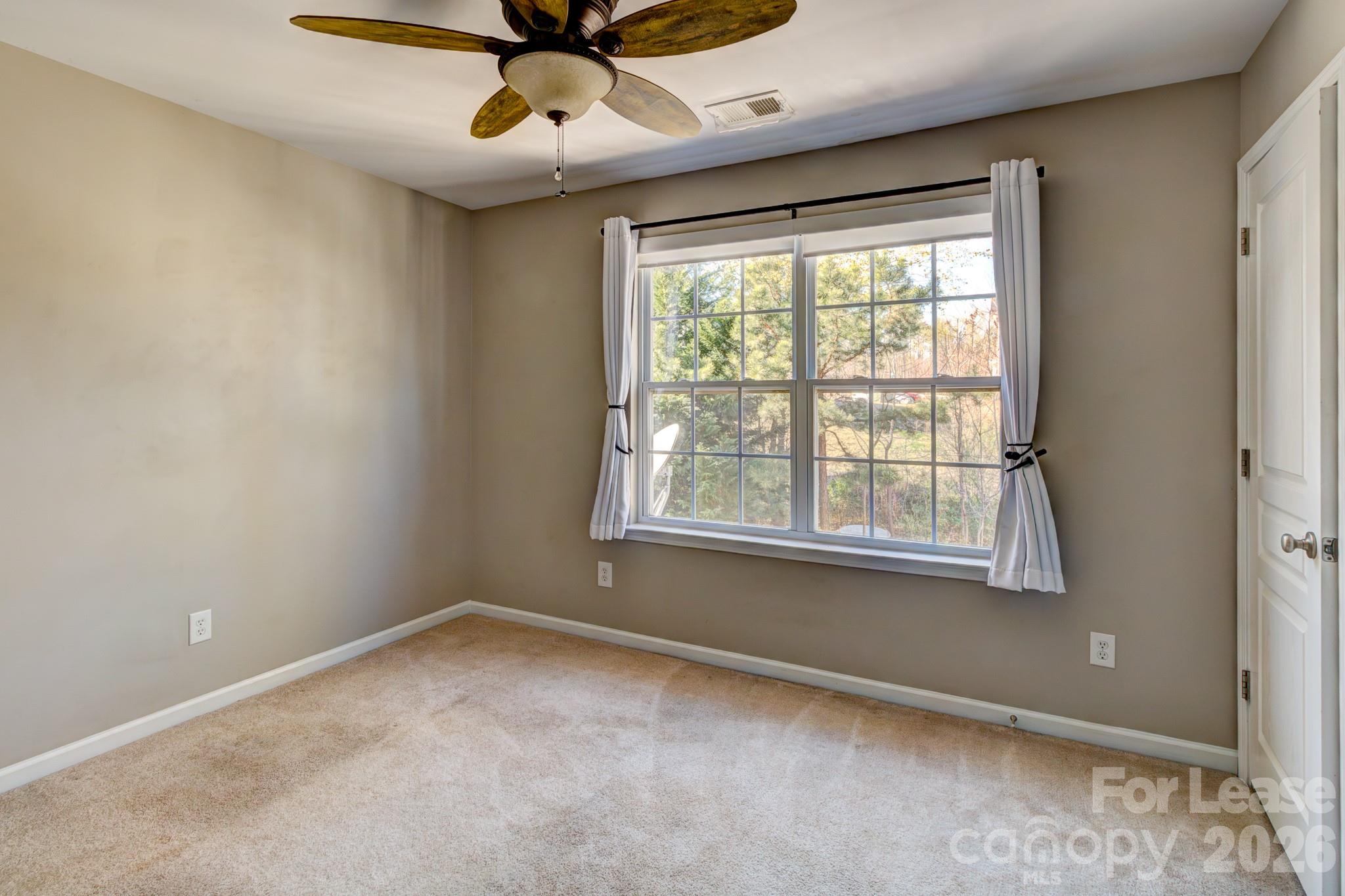 417 River Park Road Belmont, NC 28012 - Photo 10 of 16 a view of an empty room with a window
