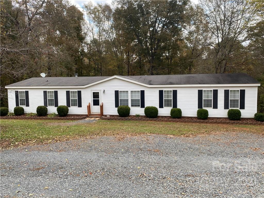 295 Bar Link Road Mount Pleasant, NC 28124 - Photo 1 of 29 a front view of a house with a garden