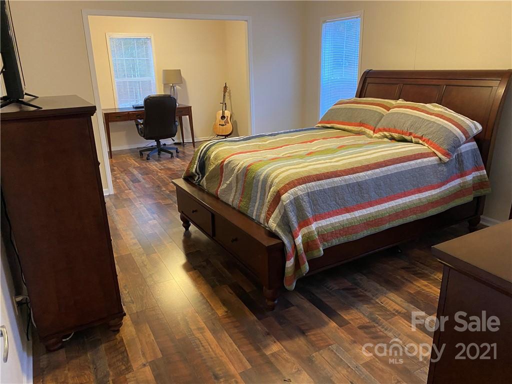 295 Bar Link Road Mount Pleasant, NC 28124 - Photo 15 of 29 a bedroom with a bed and wooden floor