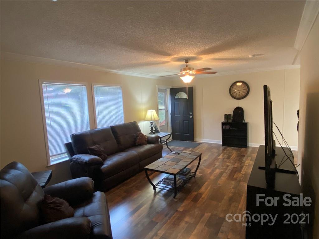 295 Bar Link Road Mount Pleasant, NC 28124 - Photo 8 of 29 a living room with furniture and a rug