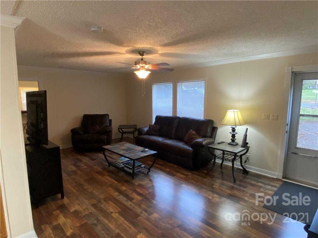 295 Bar Link Road Mount Pleasant, NC 28124 - Photo 9 of 29 a living room with furniture a lamp and a window