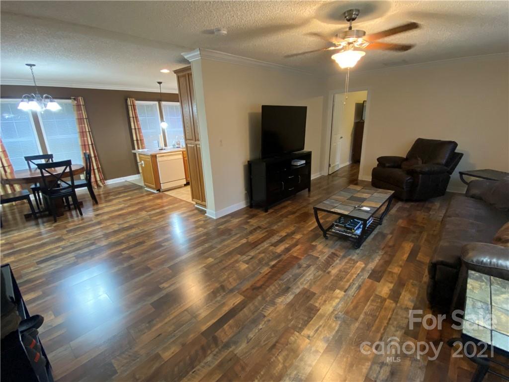 295 Bar Link Road Mount Pleasant, NC 28124 - Photo 10 of 29 a living room with furniture and a flat screen tv
