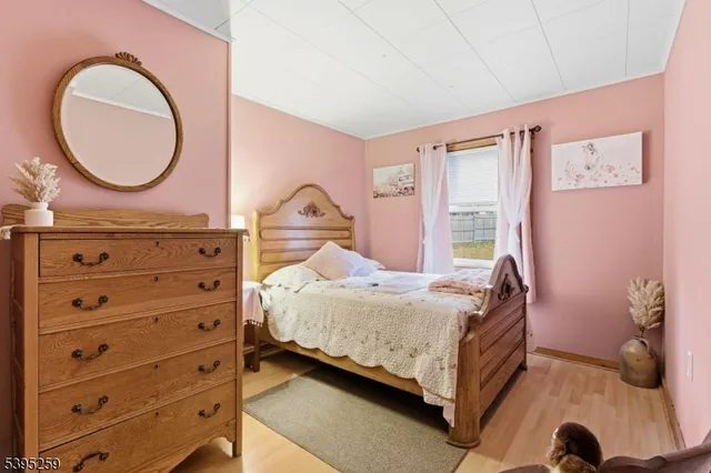 a bedroom with a bed and a dresser