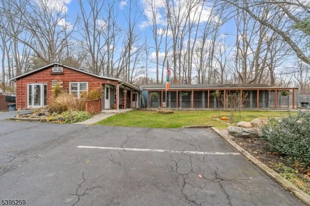 a view of a house with a yard and garage
