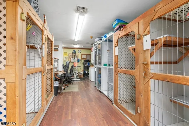 a view of a hallway with furniture and a window