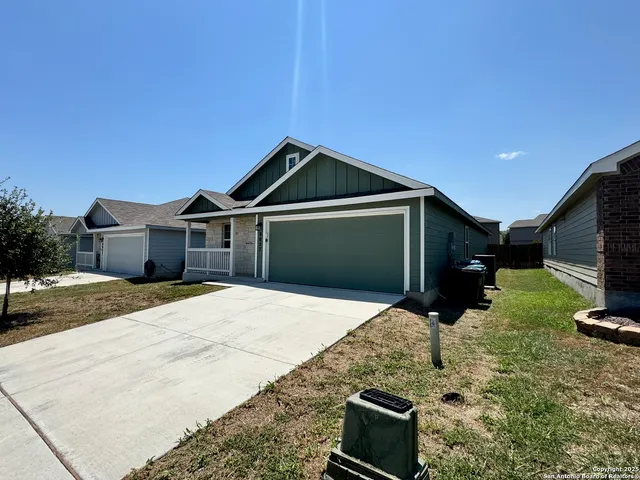 a front view of a house with parking space
