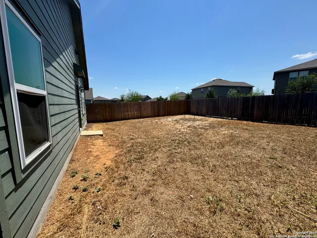a house with trees in the background