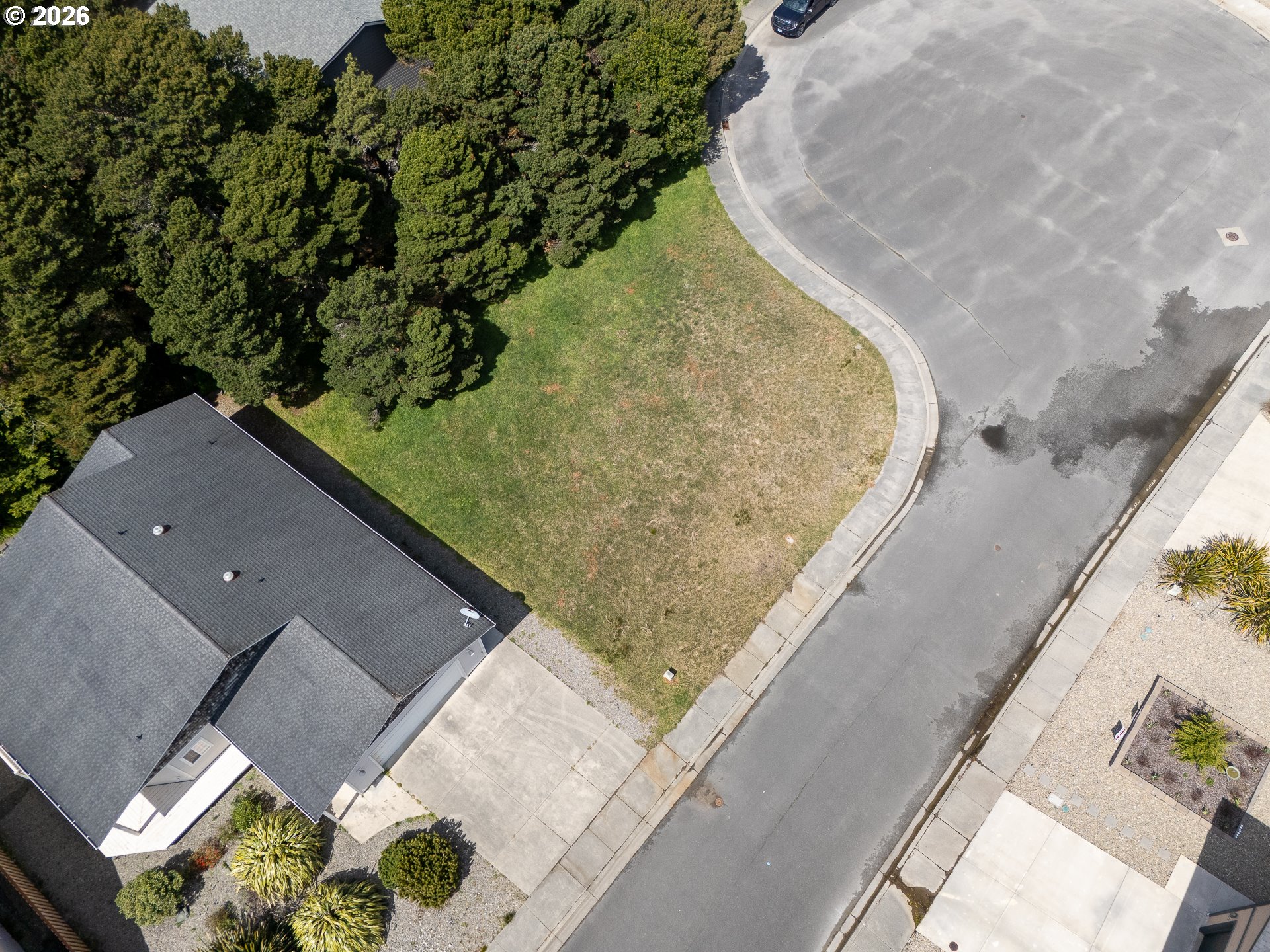3122 Periwinkle Lane Southwest, Unit 5 Bandon, OR 97411 - Photo 11 of 13 an aerial view of a house