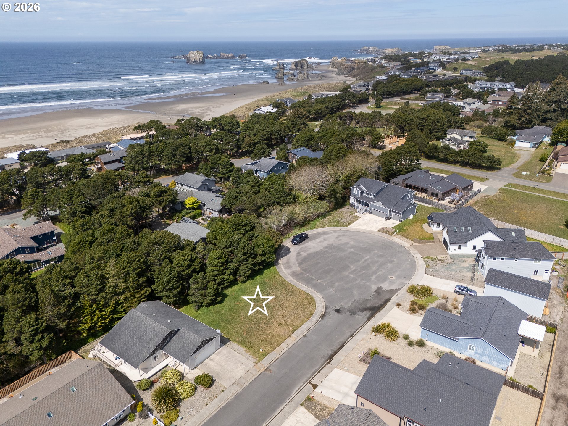 3122 Periwinkle Lane Southwest, Unit 5 Bandon, OR 97411 - Photo 2 of 13 an aerial view of residential houses with outdoor space