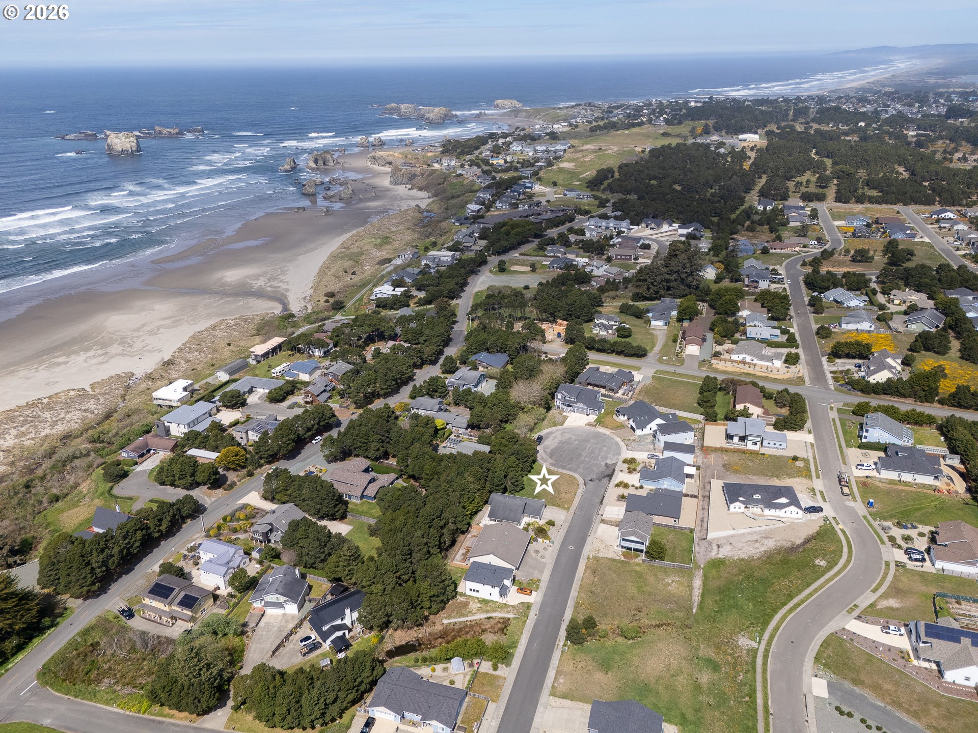 3122 Periwinkle Lane Southwest, Unit 5 Bandon, OR 97411 - Photo 4 of 13 an aerial view of residential houses with outdoor space
