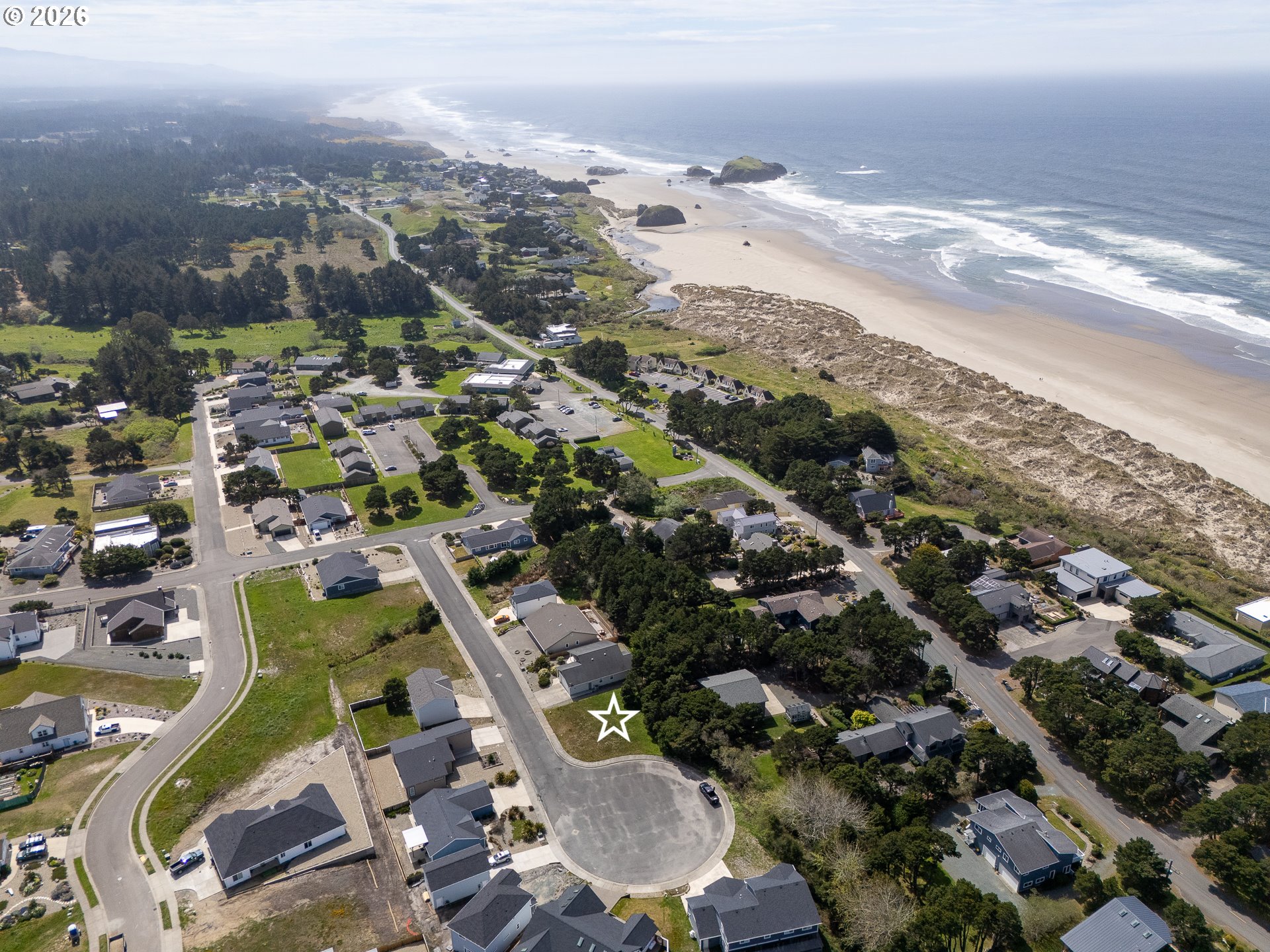 3122 Periwinkle Lane Southwest, Unit 5 Bandon, OR 97411 - Photo 5 of 13 an aerial view of residential houses with outdoor space
