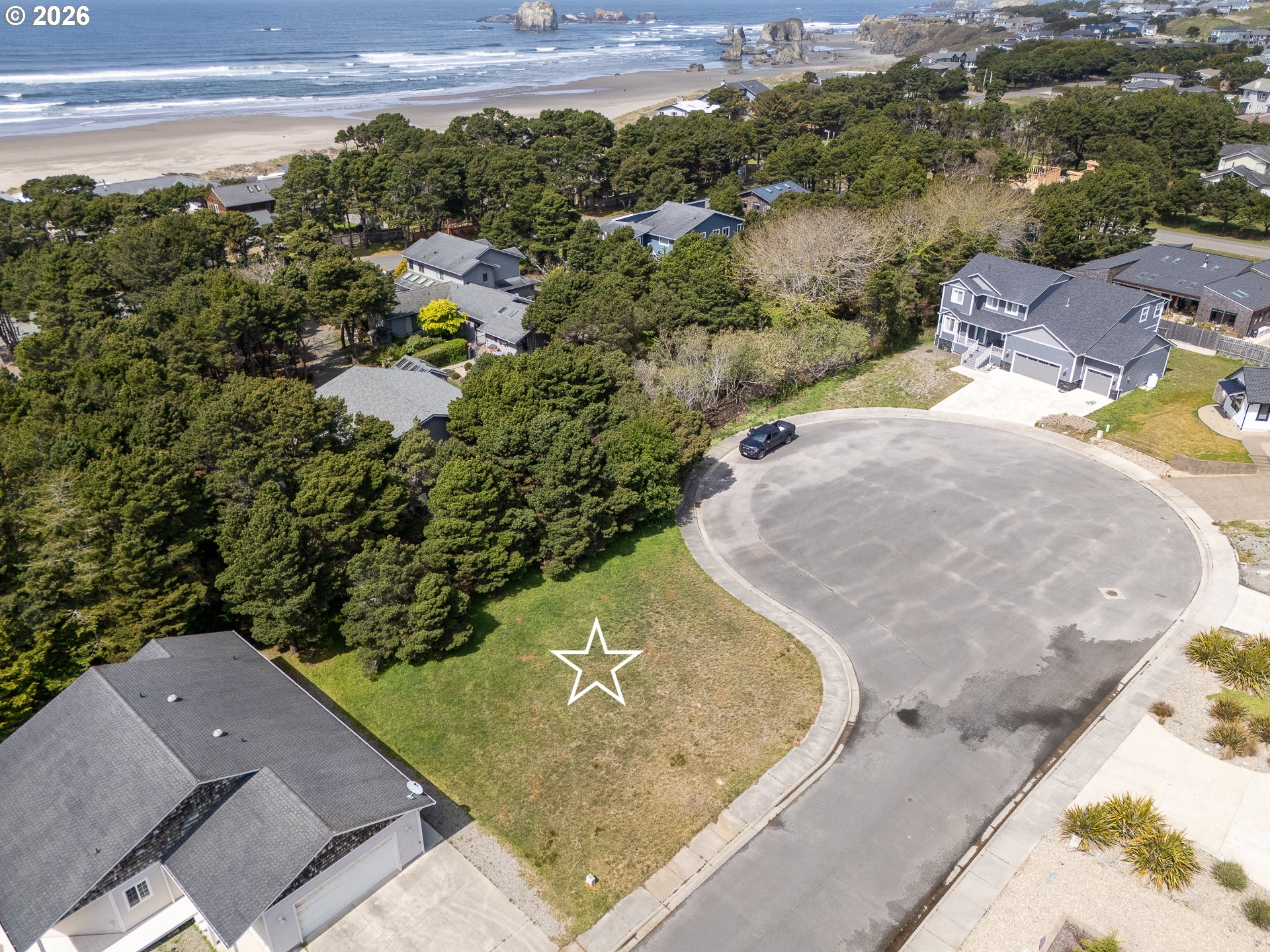 3122 Periwinkle Lane Southwest, Unit 5 Bandon, OR 97411 - Photo 9 of 13 an aerial view of a house with a yard and lake view