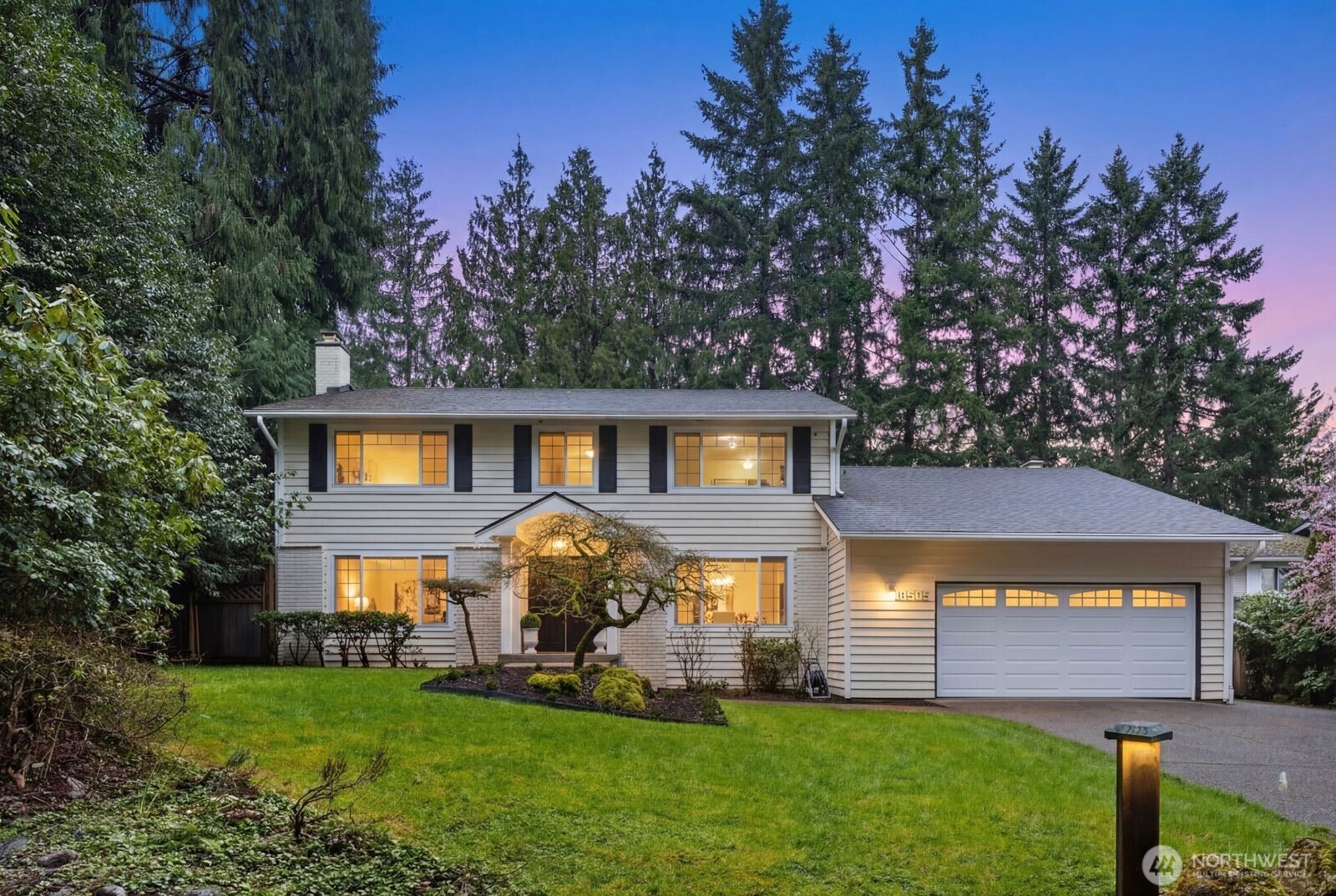 18505 Northeast 26th Street Redmond, WA 98052 - Photo 1 of 38 a front view of a house with a yard