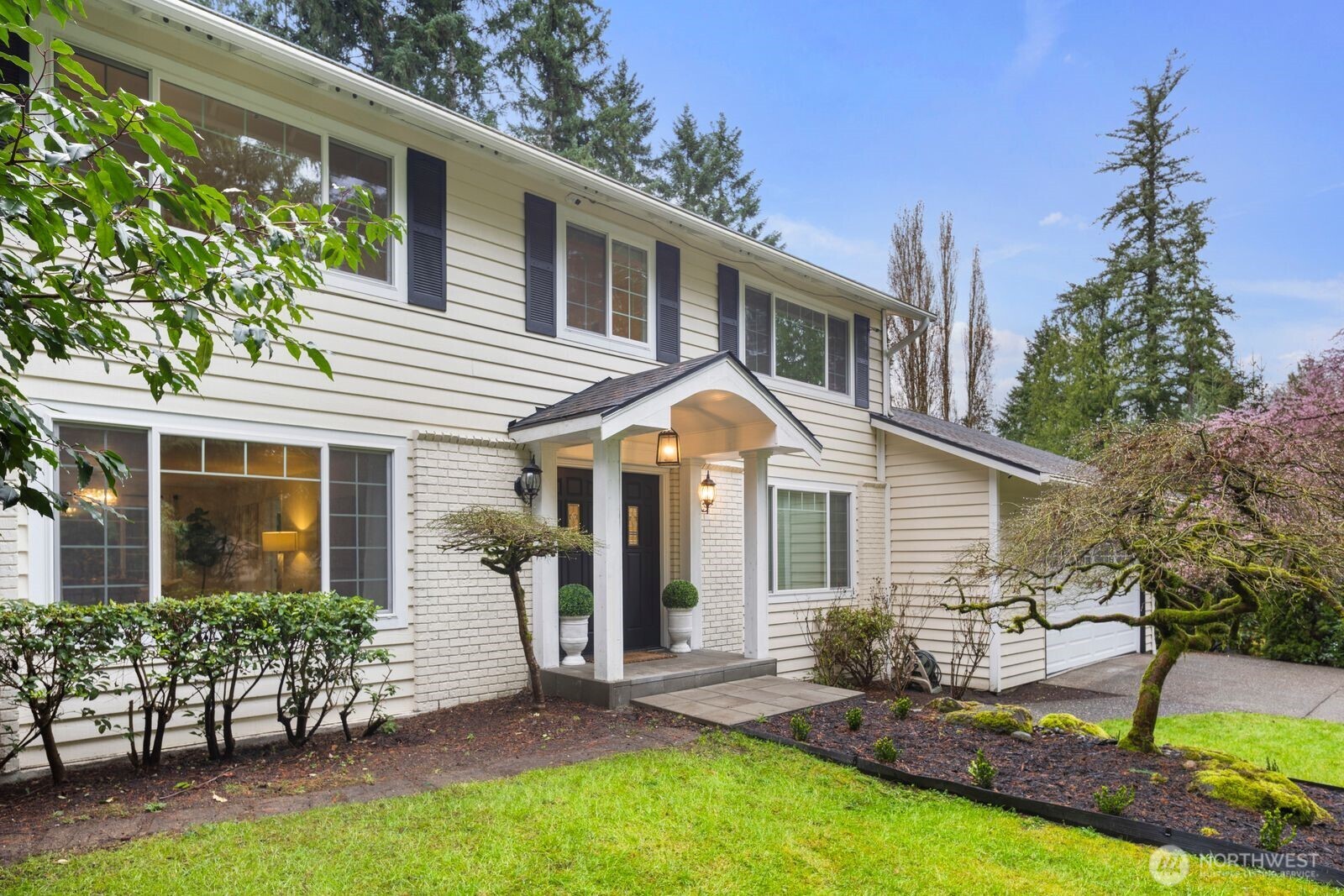 18505 Northeast 26th Street Redmond, WA 98052 - Photo 2 of 38 front view of a house with a yard