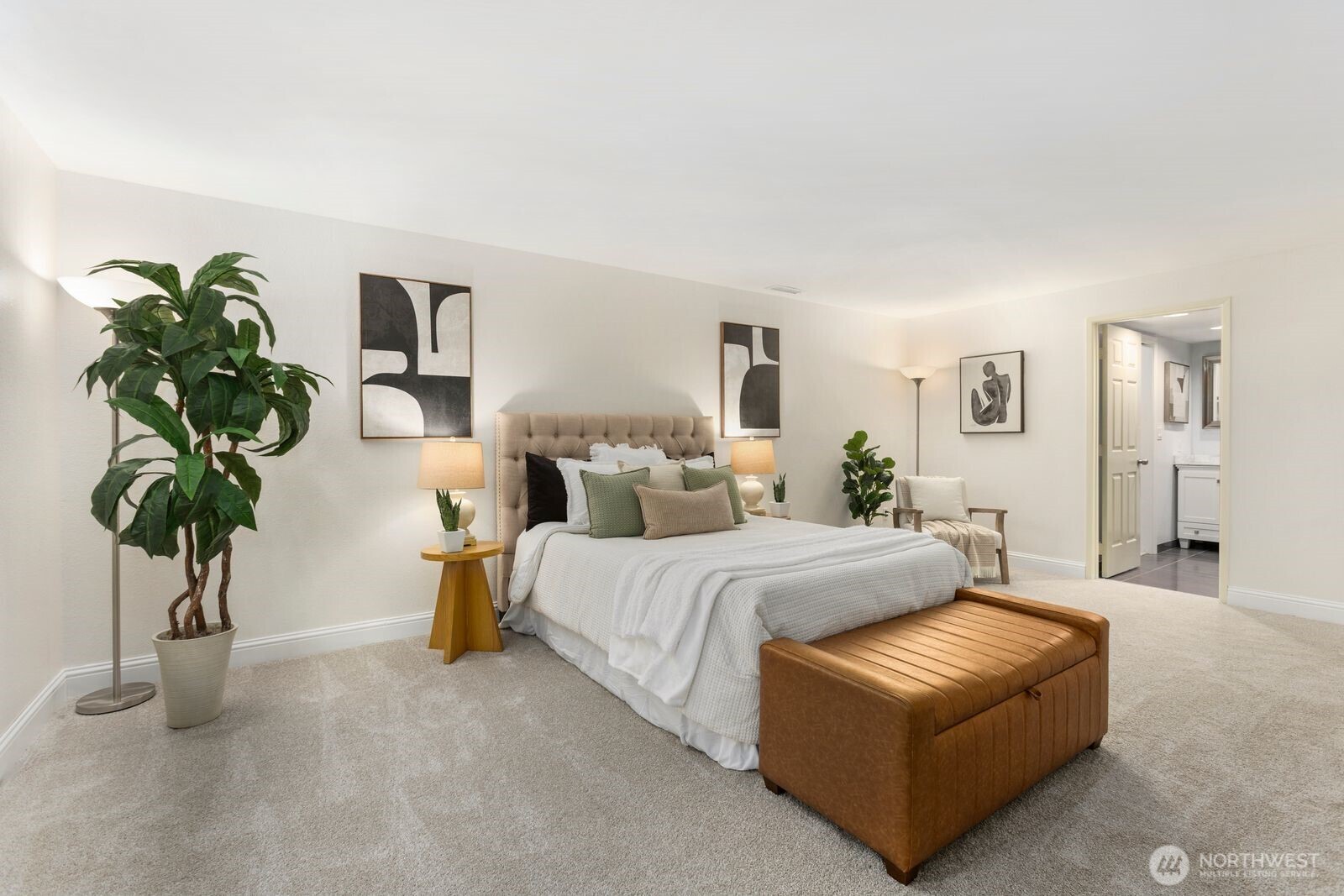 18505 Northeast 26th Street Redmond, WA 98052 - Photo 25 of 38 a bed room with bed and a potted plant