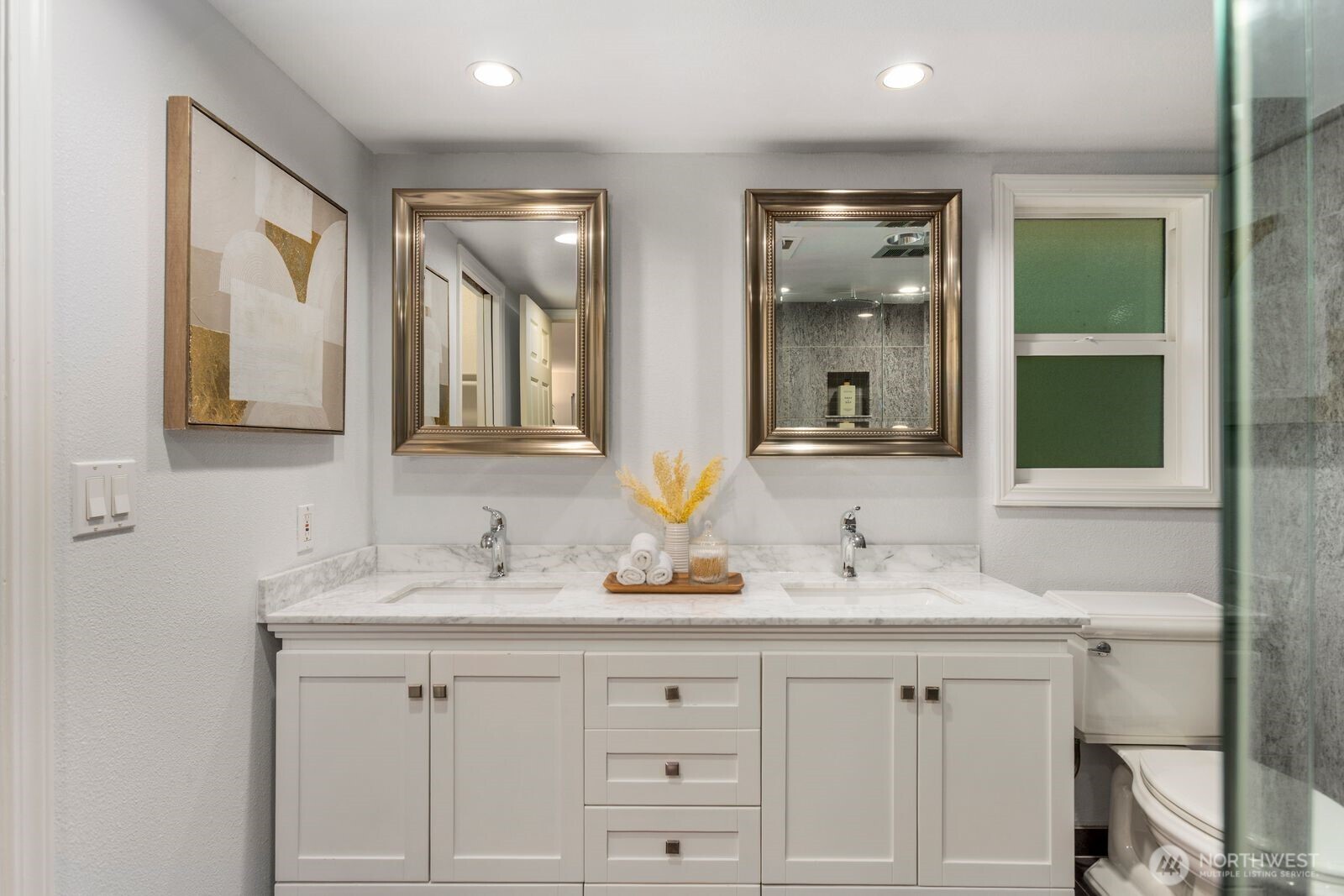 18505 Northeast 26th Street Redmond, WA 98052 - Photo 27 of 38 a bathroom with double sink and a mirror