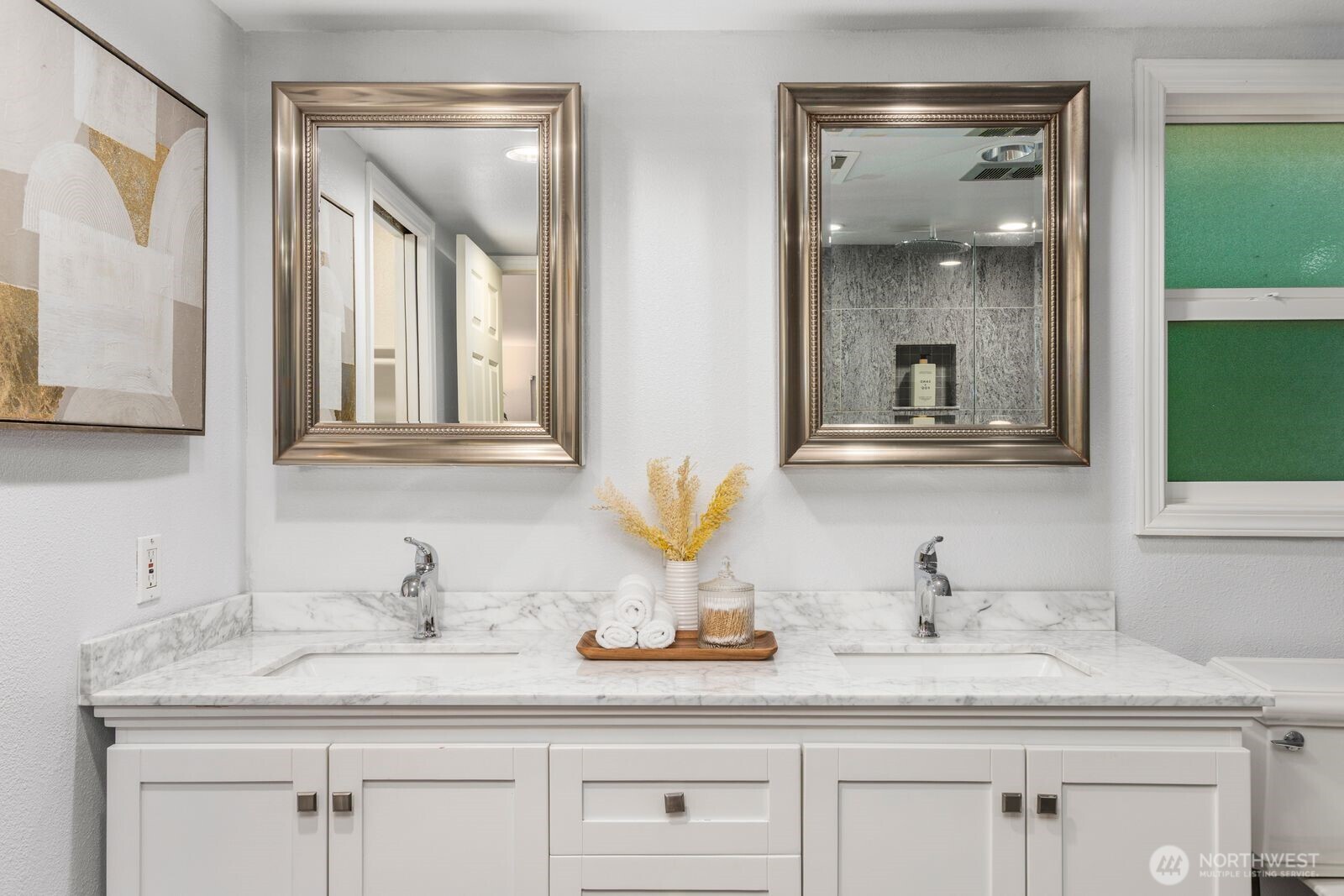 18505 Northeast 26th Street Redmond, WA 98052 - Photo 28 of 38 a bathroom with double sink and a mirror