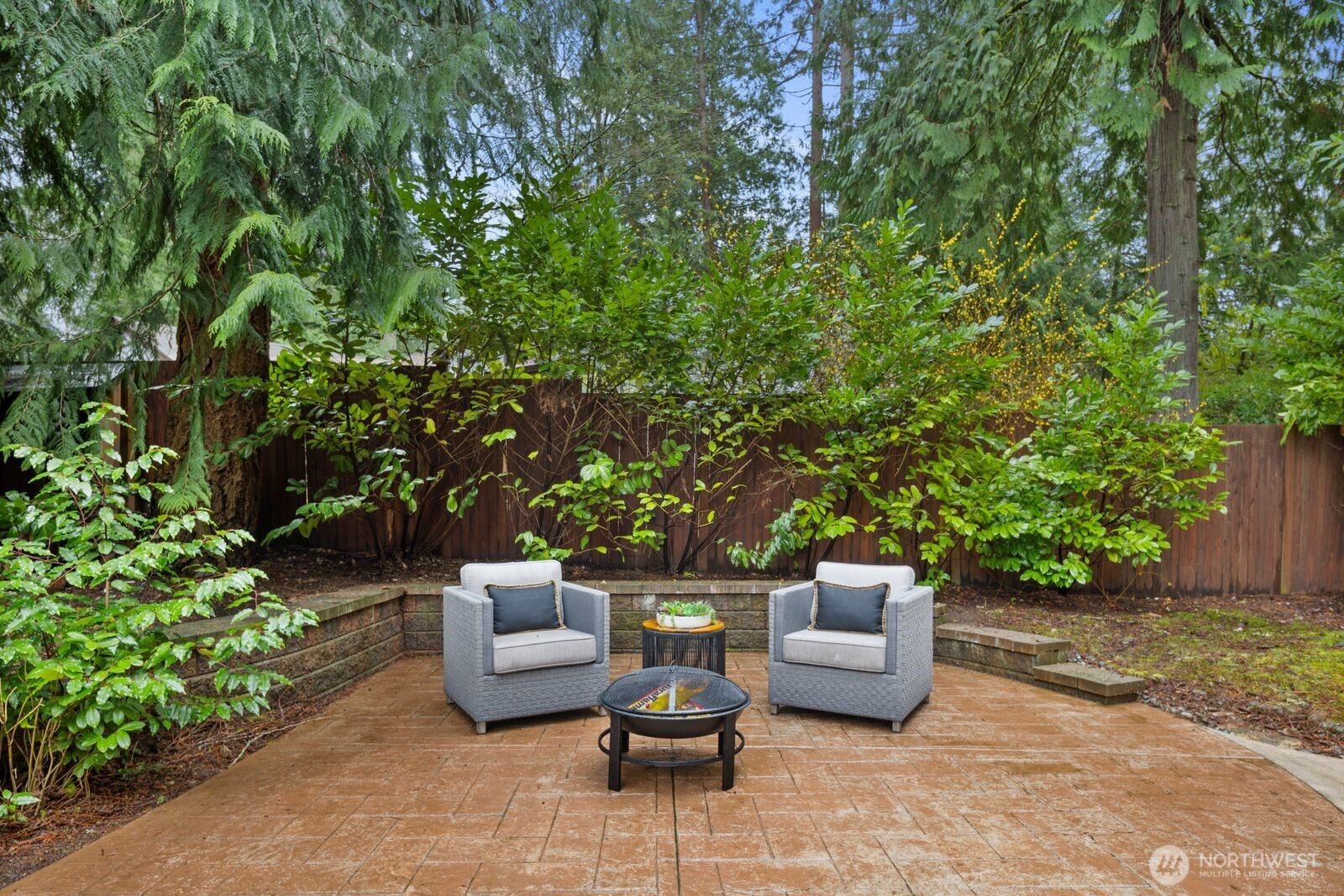 18505 Northeast 26th Street Redmond, WA 98052 - Photo 33 of 38 a view of a patio with couches and a potted plant on a table