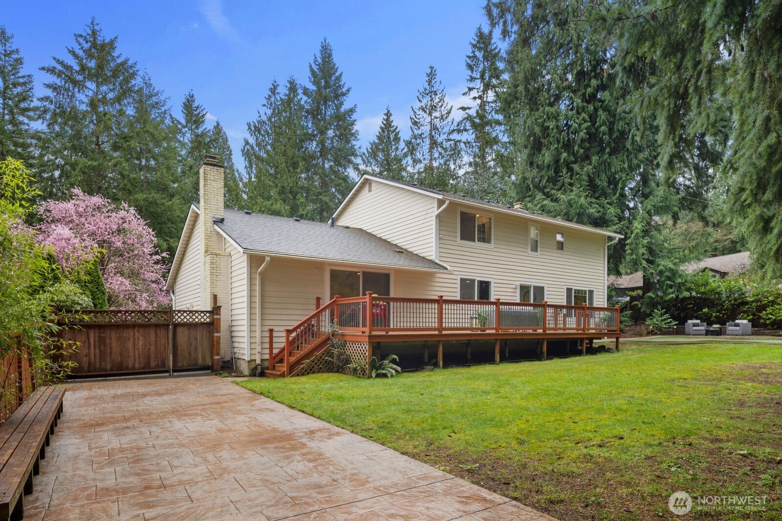 18505 Northeast 26th Street Redmond, WA 98052 - Photo 34 of 38 a view of a house with backyard and garden