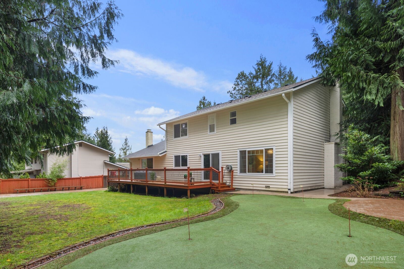 18505 Northeast 26th Street Redmond, WA 98052 - Photo 35 of 38 a view of a house with backyard and sitting area