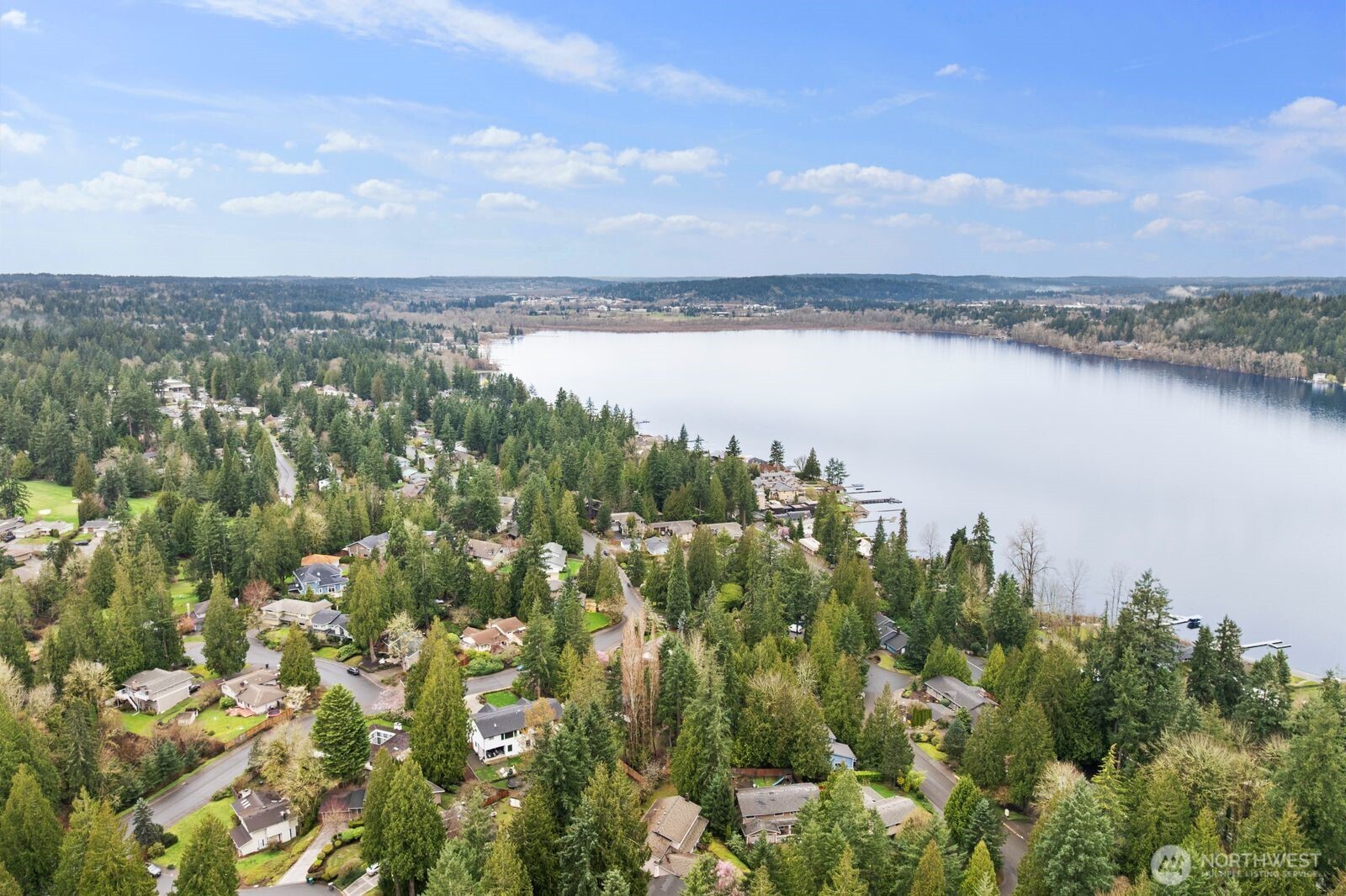 18505 Northeast 26th Street Redmond, WA 98052 - Photo 37 of 38 a view of a lake with houses in the back