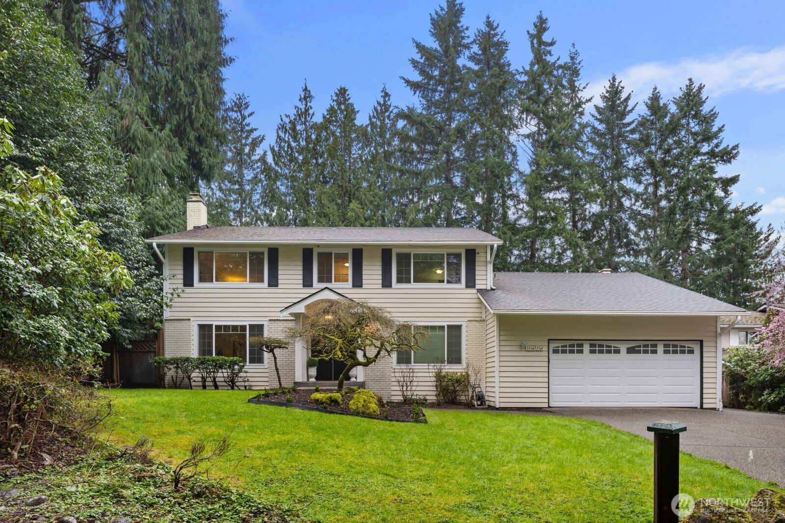 18505 Northeast 26th Street Redmond, WA 98052 - Photo 38 of 38 a front view of a house with a garden and yard