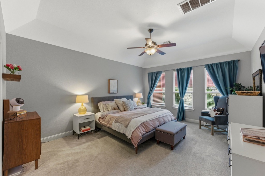5425 Cherokee Draw Road Austin, TX 78738 - Photo 19 of 40 Recessed lighting and a ceiling fan illuminate this spacious, well-appointed primary bedroom.
