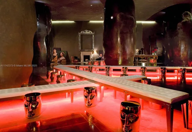 a view of an outside dining space with a table and chairs