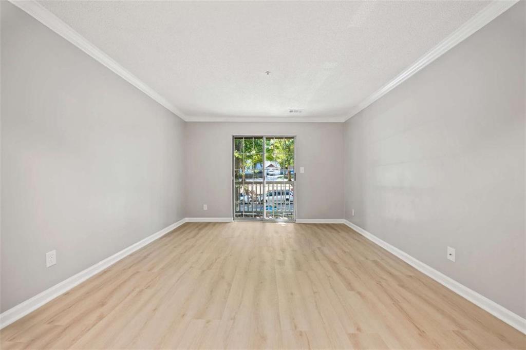 211 Cobblestone Trail Avondale Estates, GA 30002 - Photo 12 of 19 wooden floor in an empty room with a window