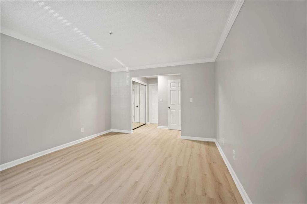 211 Cobblestone Trail Avondale Estates, GA 30002 - Photo 13 of 19 a view of empty room with wooden floor