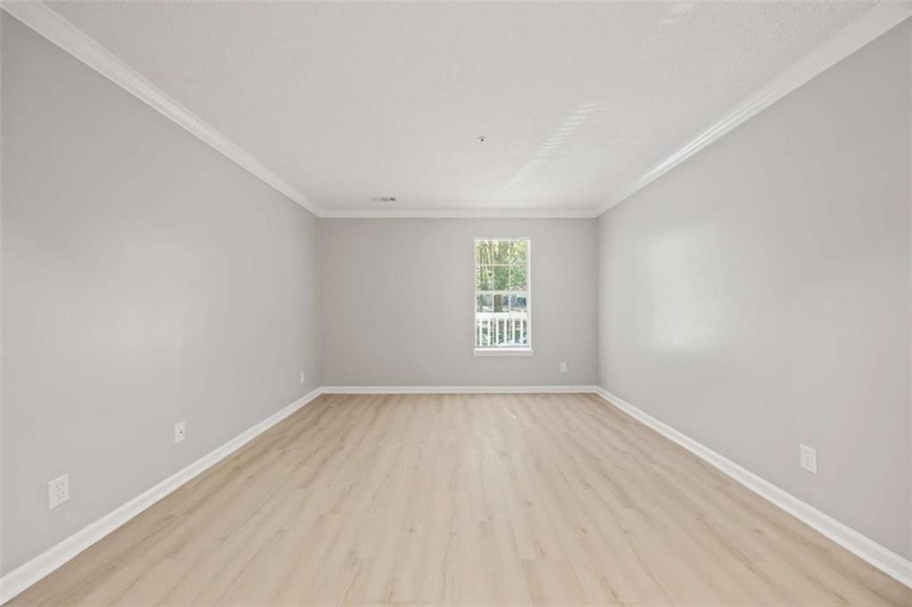 211 Cobblestone Trail Avondale Estates, GA 30002 - Photo 16 of 19 an empty room with windows