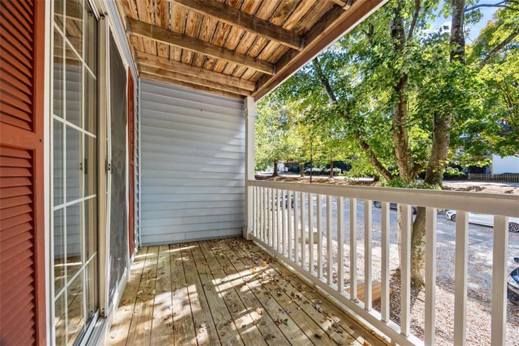 211 Cobblestone Trail Avondale Estates, GA 30002 - Photo 18 of 19 a view of a balcony with a swing