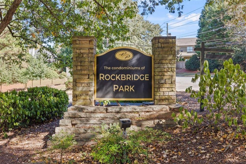 211 Cobblestone Trail Avondale Estates, GA 30002 - Photo 19 of 19 a sign that is sitting on a brick wall